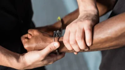 depositphotos 386965084 stock photo cropped view policeman touching hand